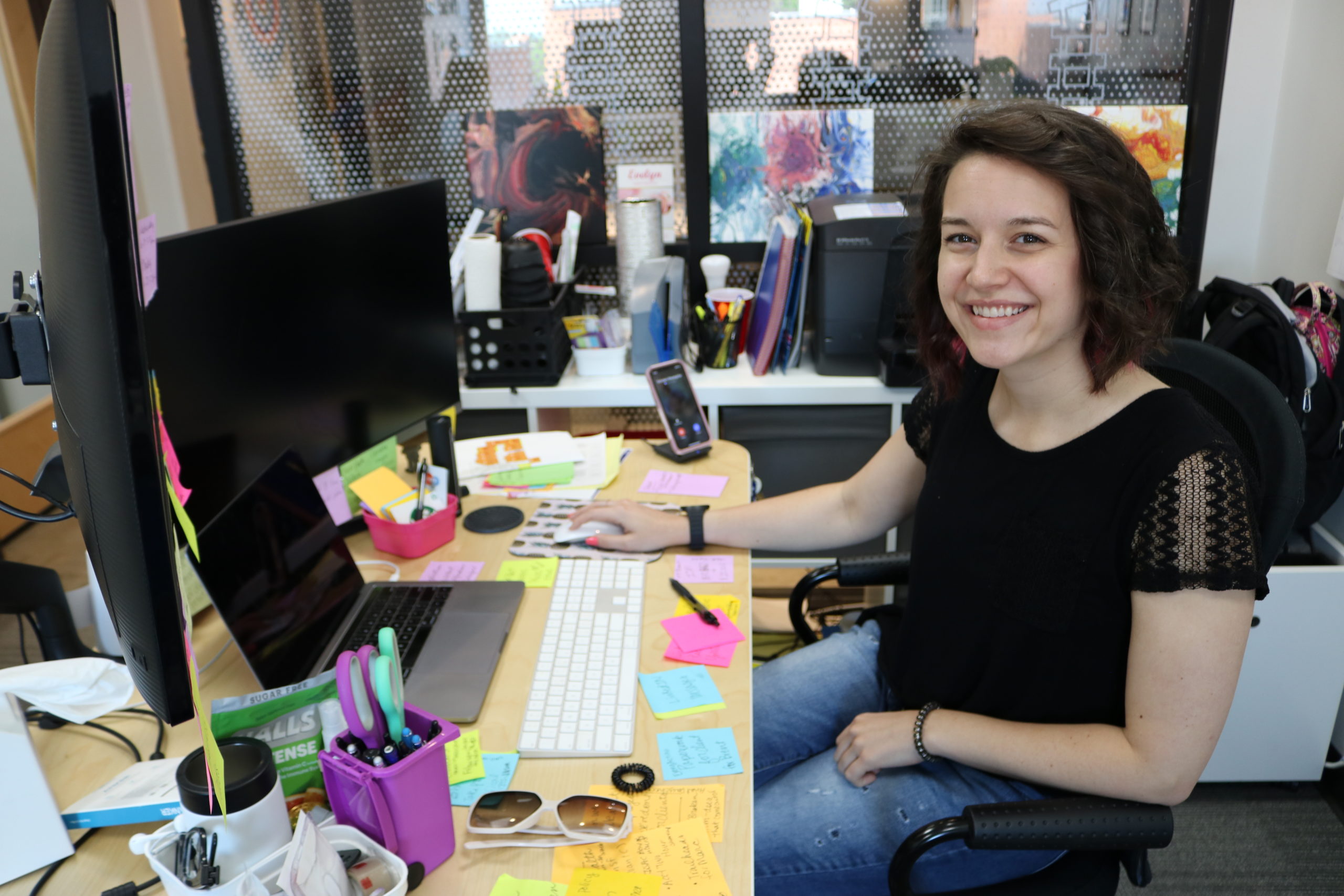 Samantha Young Executive Assistant for Venn Technology sits at her desk